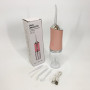 Іригатор для чищення зубів та порожнини рота Oral Irrigator з акумулятором та змінними насадками. Колір: рожевий