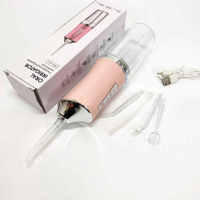 Іригатор для чищення зубів та порожнини рота Oral Irrigator з акумулятором та змінними насадками. Колір: рожевий