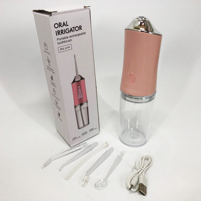 Іригатор для чищення зубів та порожнини рота Oral Irrigator з акумулятором та змінними насадками. Колір: рожевий