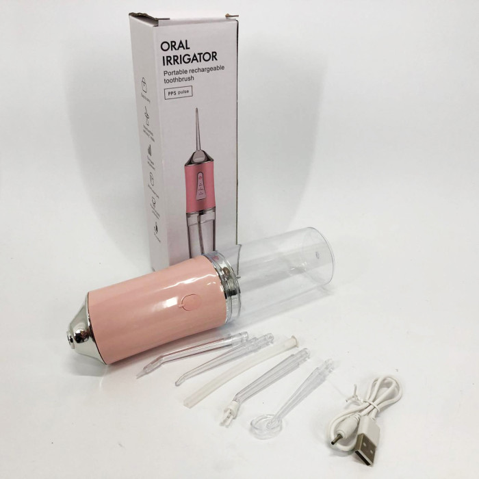 Іригатор для чищення зубів та порожнини рота Oral Irrigator з акумулятором та змінними насадками. Колір: рожевий