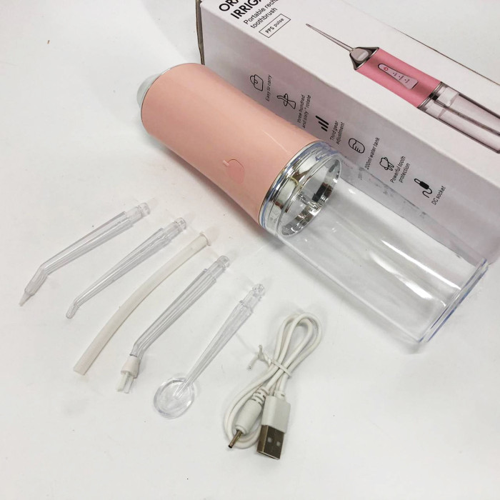 Іригатор для чищення зубів та порожнини рота Oral Irrigator з акумулятором та змінними насадками. Колір: рожевий