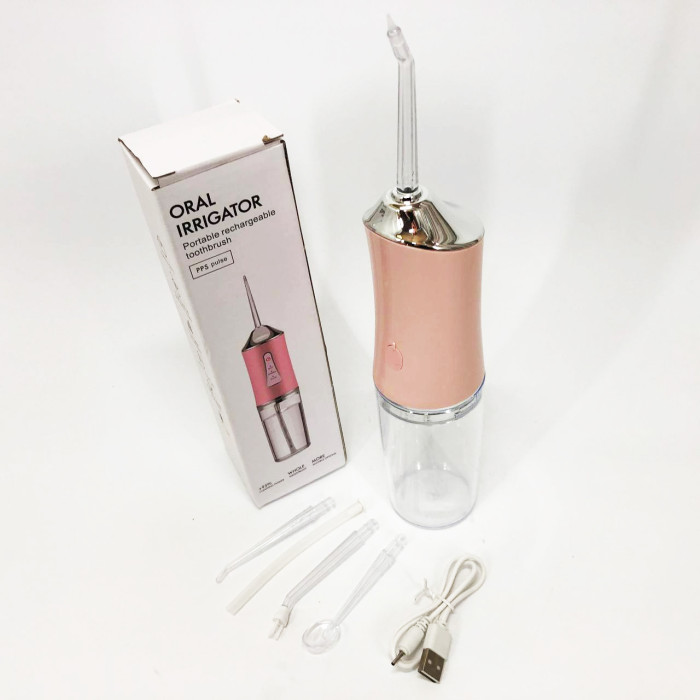 Іригатор для чищення зубів та порожнини рота Oral Irrigator з акумулятором та змінними насадками. Колір: рожевий