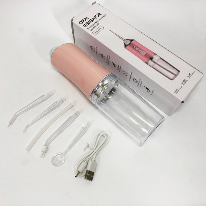 Іригатор для чищення зубів та порожнини рота Oral Irrigator з акумулятором та змінними насадками. Колір: рожевий