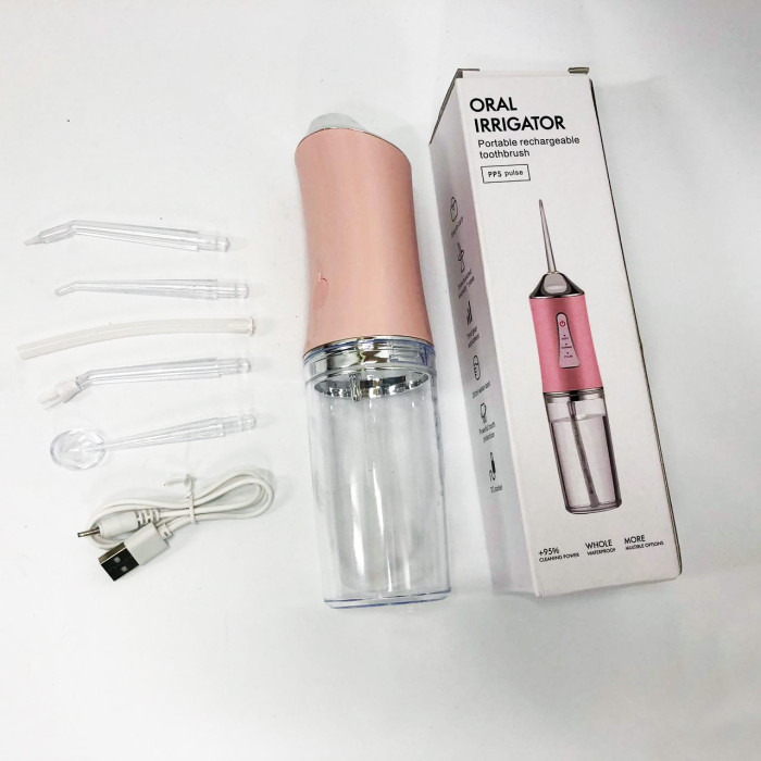 Іригатор для чищення зубів та порожнини рота Oral Irrigator з акумулятором та змінними насадками. Колір: рожевий