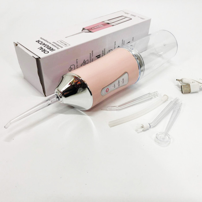 Іригатор для чищення зубів та порожнини рота Oral Irrigator з акумулятором та змінними насадками. Колір: рожевий