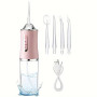 Іригатор для чищення зубів та порожнини рота Oral Irrigator з акумулятором та змінними насадками. Колір: рожевий